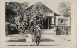 Girl and boy with violin on street, woman peers through window Santa Rosa, CA Children Postcard Postcard Postcard