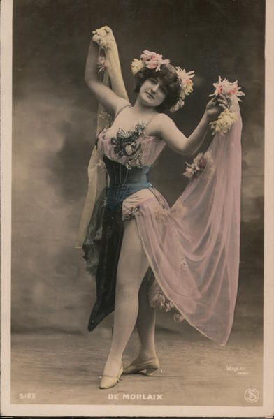 De Morlaix. Full bodied woman in pink corset dance outfit with flowers.