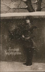 Berzliche Neujanfrsgrusse. Child with flowers standing by wall in falling snow. Postcard