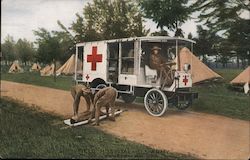 Field Hospital - U.S. Army. Tents, Red Cross wagon, man on stretcher being lifted into wagon. Postcard