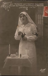 Red Cross Nurse with medicine bottle and table with candle Postcard