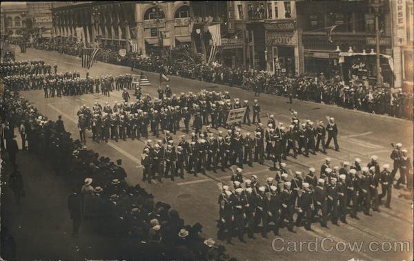 Parade. Sailors with brooms walking in formation, San Francisco and San Pedro sign California