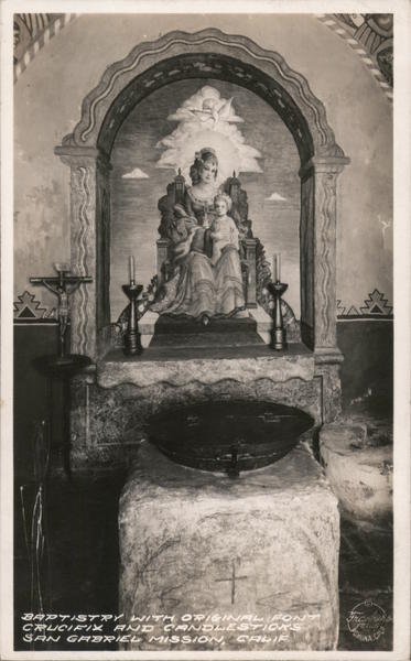 Mission baptistery with original font, crucifix, candlesticks San Gabriel California