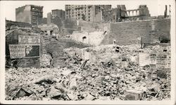 Earthquake damage, wall advertising poster intact. Original Photograph