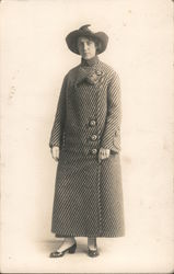 Woman wearing striped full length coat, hat Women Postcard Postcard Postcard
