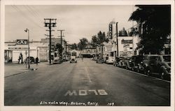 Lincoln Way, State Theater showing Dark Command, 76 Gas station Postcard