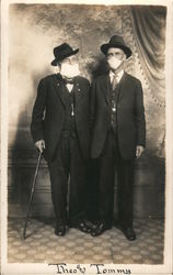 1918 Flu Epidemic. Studio photo two men wearing face masks Influenza Postcard