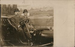 Studio portrait of two men with hats and suits sitting in car Postcard
