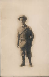 A Young Child Wearing a Hat Postcard