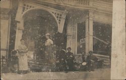 Earthquake Damage. family in front of broken storefront. Postcard