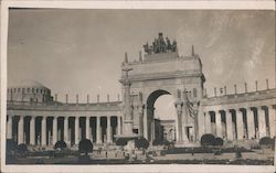 Arch and columns around a plaza with gardens Postcard