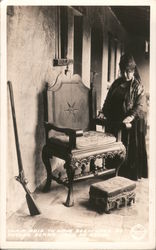 Chair said to have been used by Father Serra, Casa De Adobe, rifle, woman in black Postcard