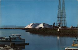 Mountain of salt at deep water port, dock, boat, electrical tower Postcard