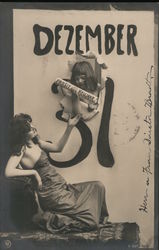 Girl in calendar dated Dezember 31 handing Prosit Neu Jahr to maiden Postcard