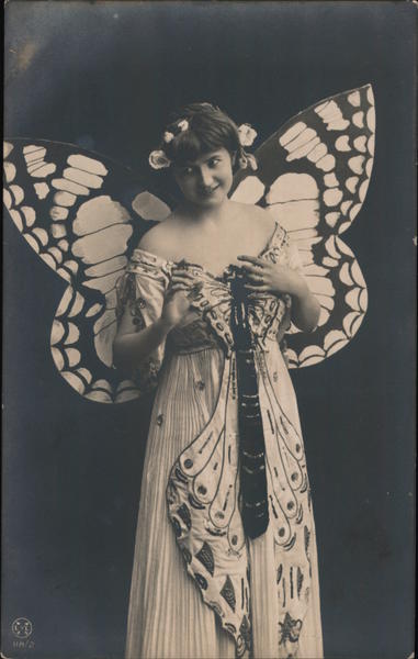 Woman wearing butterfly costume with butterfly wings