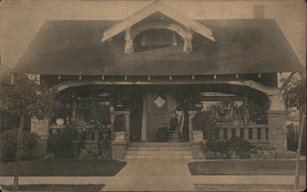 Bungalow, Woman rocking on her porch, street view California