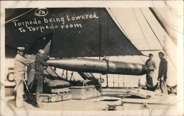 Torpedo being lowered to torpedo room on ship Ships