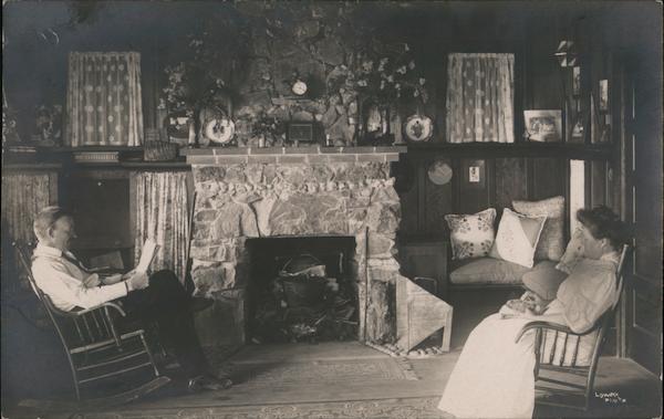 Man and wife rocking chairs, living room, stone fireplace, wood floors Monte Rio California