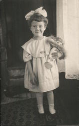 Young girl with a doll Postcard