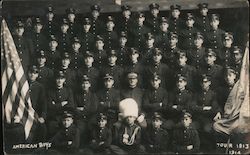 American Boys group photo, uniforms, one has large furred white hat. Tour 1913-1914 Postcard
