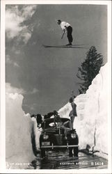 Up and Over. Man skiing over two girls on car Postcard Postcard Postcard