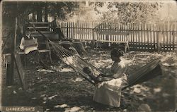 A Woman Sitting with a Child in a Hammock Postcard