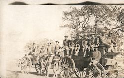 Soldiers sitting on horse drawn wagon pulling tool wagon Postcard