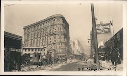 Ruins after earthquake, men cleaning street, streetcar, The Emporium. Original Photograph