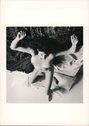 Annabel Brooks naked on bed as Henrietta Moraes in John Maybury's film Love is the Devil. Postcard