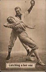 Catching a hot one. Baseball player catching ball and girl player Postcard