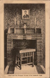 A desk made from newspaper accounts of Col. Lindbergh's flight. Postcard