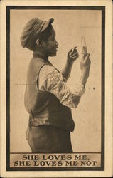 She loves me, She loves me not. Black boy peeling a banana Postcard