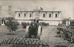 Mogul Oil Tractor cultivating the orchard on the International Harvester grounds Postcard