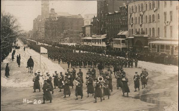 Military parade with marching band in a city in winter