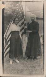 Two Women Holding Large American Flag Postcard