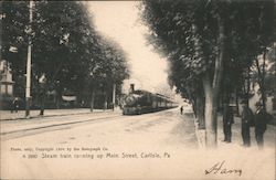 Steam Train Running Up Main Street Postcard