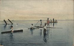 People on small boats on body of water Postcard