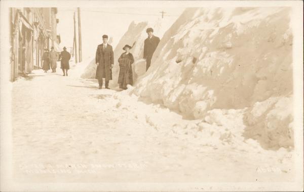 Photo of People Next to High Snow Bank