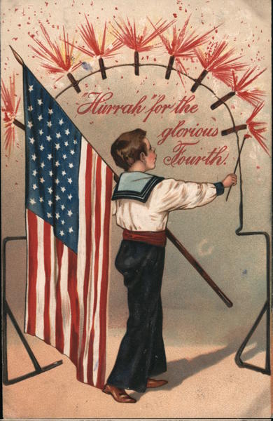 Hurrah for the glorious Fourth! Boy with flag lights firecrackers