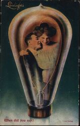 Lovelights - A man and woman inside a lightbulb Postcard