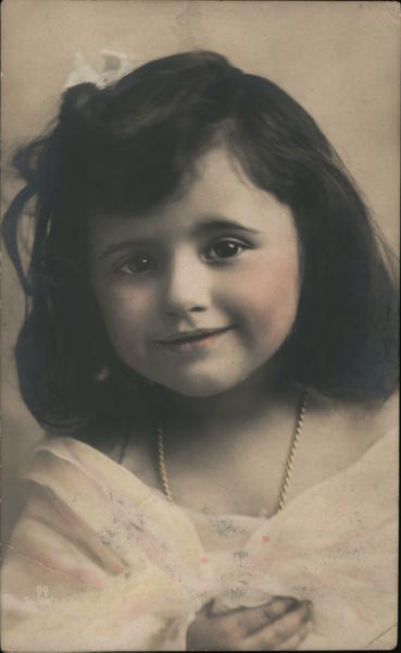 Photograph of a smiling young girl with necklace in a nice dress Czech Republic