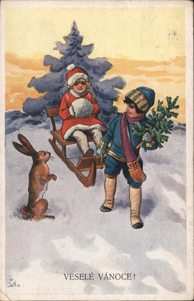 vesele vanoce! Merry Christmas! Boy and girl sled with a rabbit