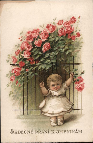Heartfelt Wishes to You - A baby stands in front of a fence and rosebush. She is holding a rose.