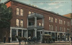 Orleans Hotel on the Corner of Bank and Platt Streets. Horse and carriage in front of hotel. Postcard