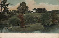 A Glimpse of Maplewood. A general scenic view of a home and grounds alongside a river. Postcard