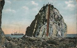 Sugar Loaf, Santa Catalina Island - A large boulder with a ship in the distance Postcard