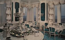 Top of the Tower Restaurant - A photo of a very elaborate white and teal dining room. Postcard