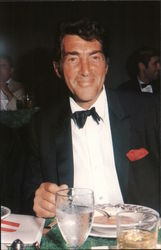 Photograph of Dean Martin eating a meal Postcard