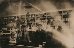 Men working the counter at a store Postcard