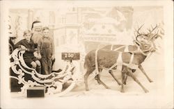 Santa With Children Reindeer and Sleigh Postcard